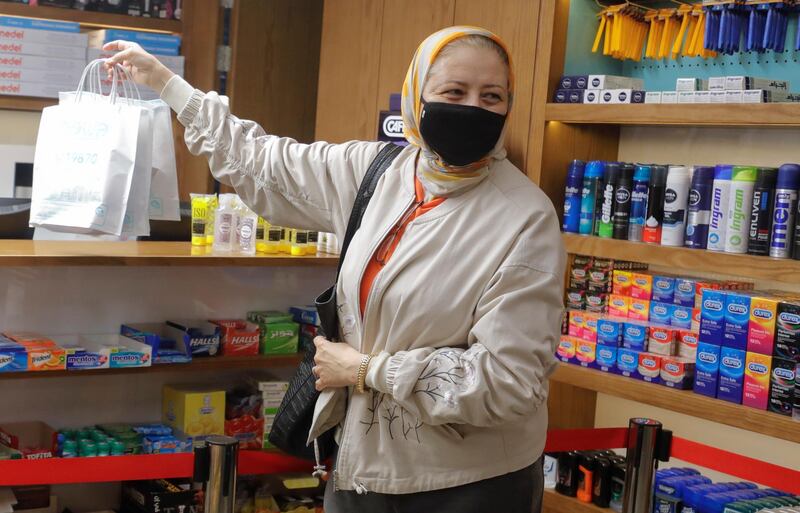 An Egyptian woman wears a protective mask in "Dawa Pharmacy" the first Egyptian pharmacy using a robotic device that handles prescriptions, due to the outbreak of the coronavirus disease (COVID-19), in Cairo, Egypt May 9, 2020. Picture taken May 9, 2020. REUTERS/Amr Abdallah Dalsh
