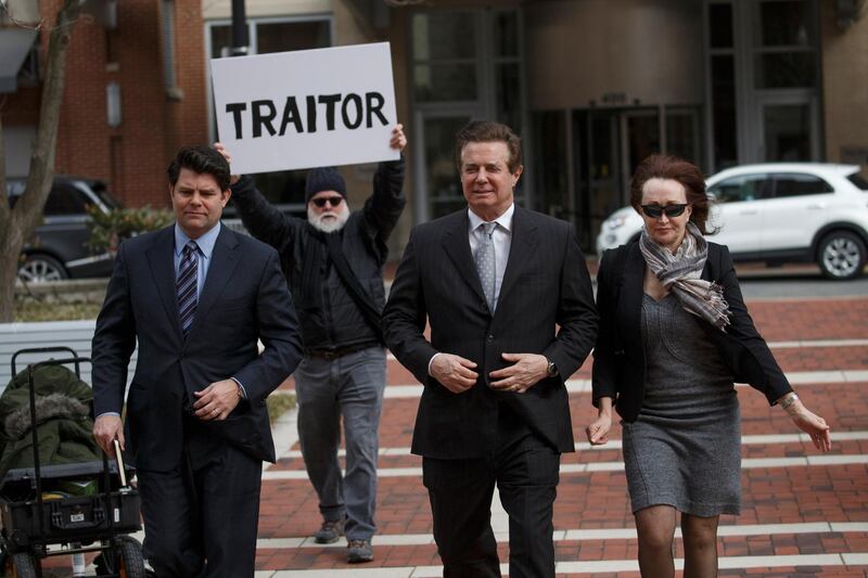 epa07020051 (FILE) - Former Trump Campaign Manager Paul Manafort (C), with his wife Kathleen Manafort (R), arrives for arraignment at the Federal Courthouse in Alexandria, Virginia, USA, 08 March 2018 (reissued 14 September 2018). Media reports on 14 September 2018 state Manafort, who in August was found guilty of tax and bank fraud charges, has reportedly agreed to a deal and plead guilty in the investigation of Special Counsel Robert Mueller. Manafort is said to be willing to plead guilty to two criminal counts - one count of conspiracy to obstruct justice and to one count of conspiracy against the USA.  EPA/SHAWN THEW