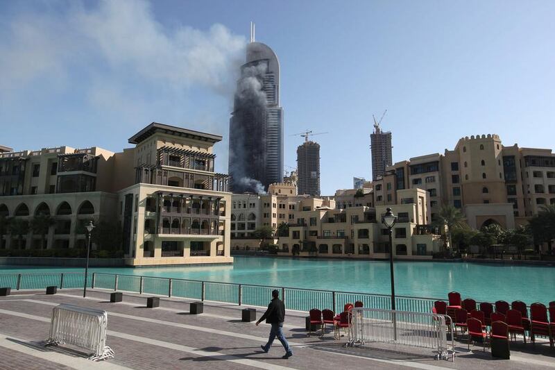 Smoke billows from The Address Downtown Dubai. Jon Gambrell / AP Photo
