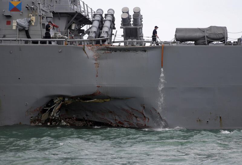 The US Navy guided-missile destroyer USS John S McCain is seen after a collision in Singapore waters. Ahmad Masood / Reuters