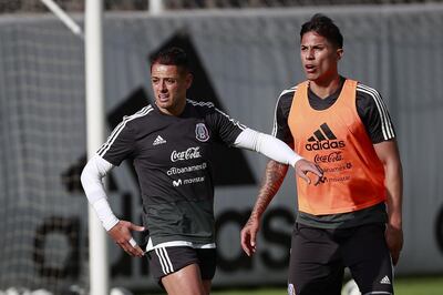 epa06779546 Mexican soccer players Javier Hernandez (L) and Carlos Salcedo (R) train with their team at the High Performance Center in Mexico City, Mexico, 01 June 2018. The Mexican national soccer team will play a friendly match against Scotland at the Azteca stadium on 03 June 2018.  EPA/JOSE MENDEZ