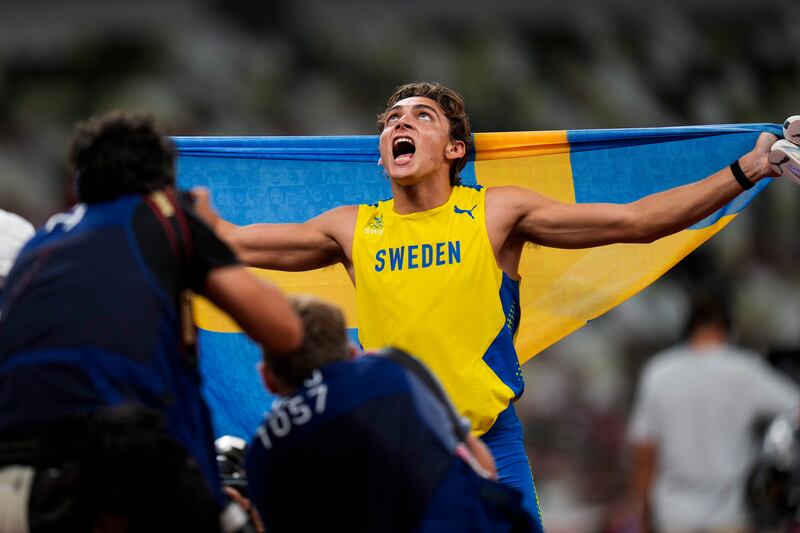Armand Duplantis, of Sweden, celebrates after winning the final of the men's pole vault.