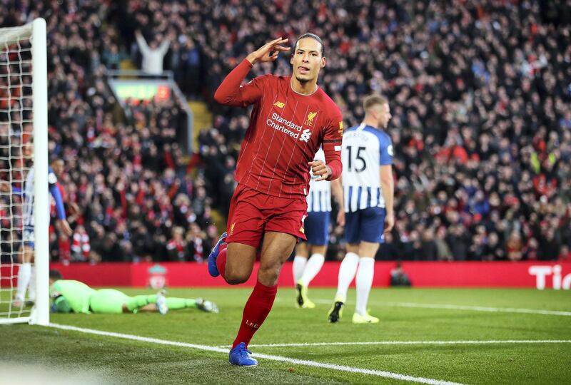 LIVERPOOL, ENGLAND - NOVEMBER 30:  Virgil van Dijk of Liverpool celebrates after scoring his teams first goal during the Premier League match between Liverpool FC and Brighton & Hove Albion at Anfield on November 30, 2019 in Liverpool, United Kingdom. (Photo by Clive Brunskill/Getty Images)
