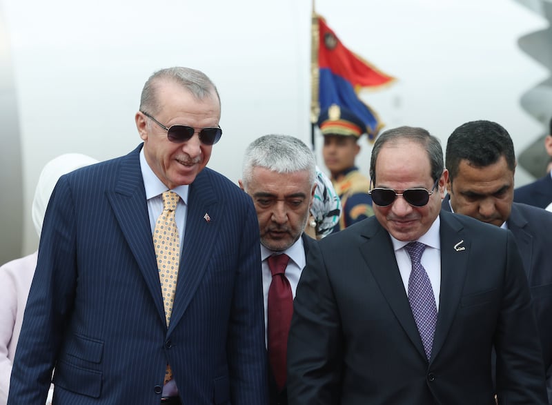 Egyptian President Abdel Fattah El Sisi, right, welcomes Turkish President Recep Tayyip Erdogan at Cairo Airport on February 14. EPA