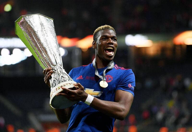 Paul Pogba celebrates with the Europa League trophy. Georgi Licovski / EPA