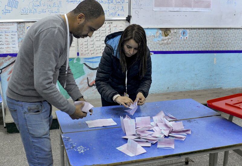 ISIE agents begin counting ballots at a polling station in Tunis during the parliamentary election. AFP