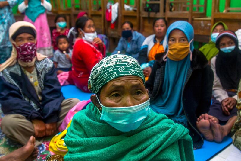 Villagers gather inside a makeshift shelter at a class room after they fled their villages due to the eruption of Mount Semeru in Lumajang, East Java, Indonesia. EPA