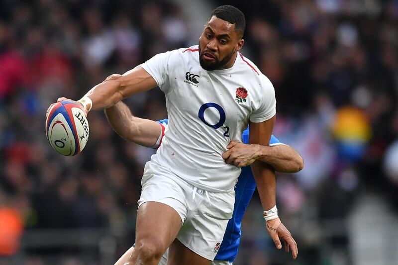 Italy's wing Angelo Esposito (R) tackles England's wing Joe Cokanasiga during the Six Nations international rugby union match between England and Italy at Twickenham, west London, on March 9, 2019. / AFP / Ben STANSALL
