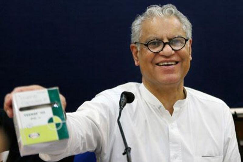 Anand Grover, a lawyer for the Cancer Patients Aid Association, shows a package of a generic version of the cancer drug Glivec after India's Supreme rejected Novartis' bid to patent Glivec on Monday. Manish Swarup / AP Photo