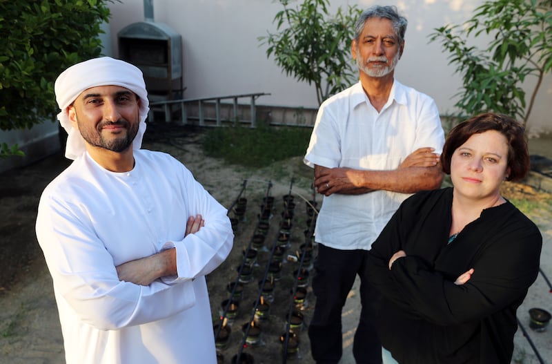 Abdulaziz bin Redha, chief executive and founder of Hyvegeo  with Dr Larissa Nicholas, biochar science lead, right, and Dr Harjit Singh, chief engineer and co-founder. All photos: Chris Whiteoak / The National 