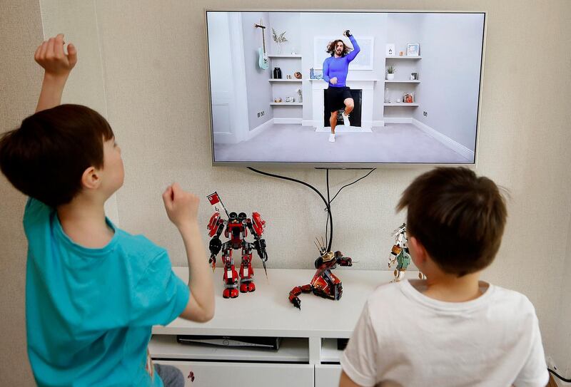 Ben and Isaac Rickett follow PE with Joe. Martin Rickett/PA via AP