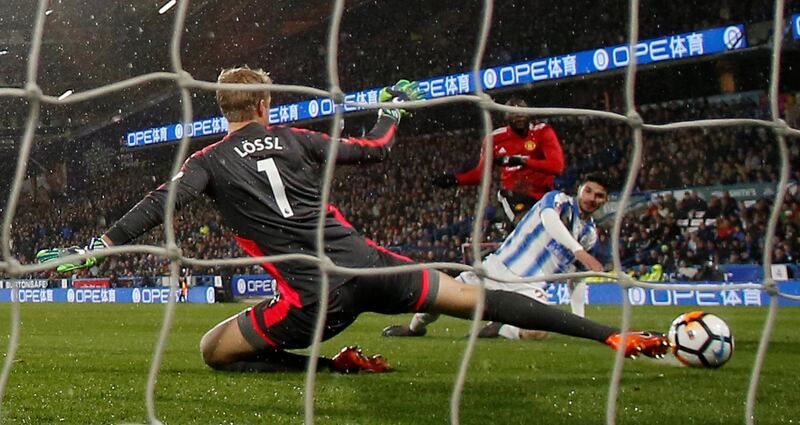 Soccer Football - FA Cup Fifth Round - Huddersfield Town vs Manchester United - John Smith’s Stadium, Huddersfield, Britain - February 17, 2018   Manchester United's Romelu Lukaku scores their first goal past Huddersfield Town’s Jonas Lossl    REUTERS/Andrew Yates