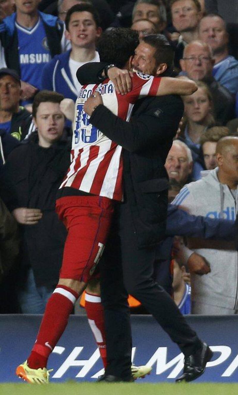 Atletico Madrid manager Diego Simeone, right, celebrates with striker Diego Costa during their Champions League victory on Wednesday night over Chelsea. Sergio Perez / Reuters / April 30, 2014   