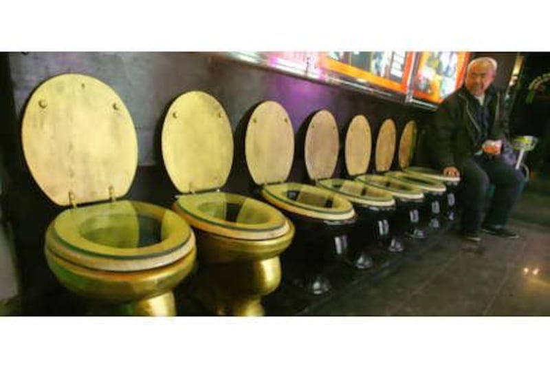 A customer rests on a seat fashioned after a western-style toilet at a shopping mall in Nanjing. "In recent years, China's public toilets have increasingly become the frontier zones of a new nation."