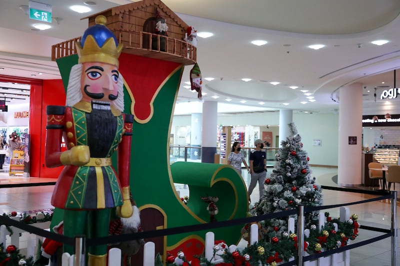 Colourful Christmas Santa boot decor at Al Wahda Mall, Abu Dhabi. Khushnum Bhandari / The National