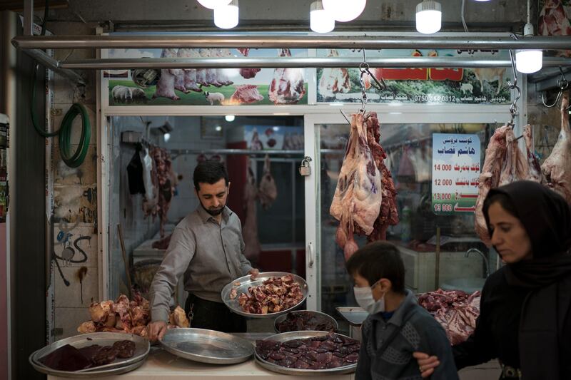 A butcher sells meat in a bazaar in central Irbil, Iraq, Sunday, Oct. 29, 2017. (AP Photo/Felipe Dana)