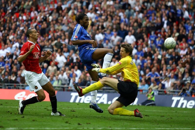 LONDON - MAY 19:  Didier Drogba of Chelsea beats Edwin Van der Sar of Manchester United to score their first goal during the FA Cup Final match sponsored by E.ON between Manchester United and Chelsea at Wembley Stadium on May 19, 2007 in London, England.  (Photo by Shaun Botterill/Getty Images)