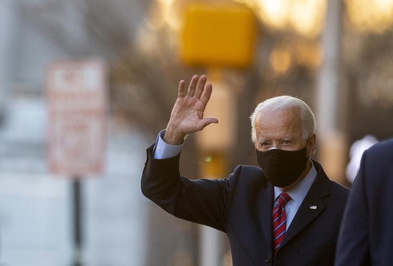 President-elect Joe Biden waves as he departs the Queen Theatre after meeting virtually with the United States Conference of Mayors in Wilmington, Delaware. AFP