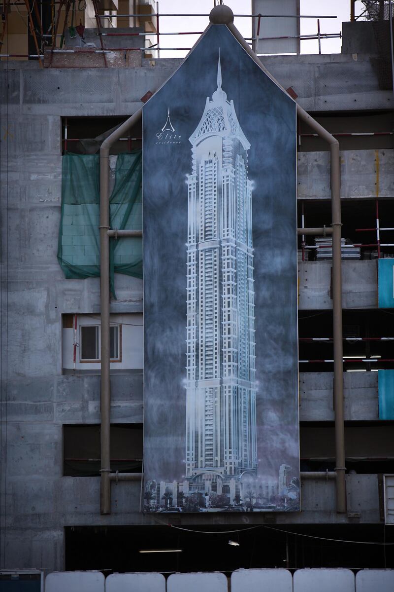 United Arab Emirates - Dubai - January 3, 2011.

BUSINESS: A billboard for the "Elite Residence" hangs outside the construction site on the north end of the Dubai Marina on Monday, January 3, 2011. Amy Leang/The National