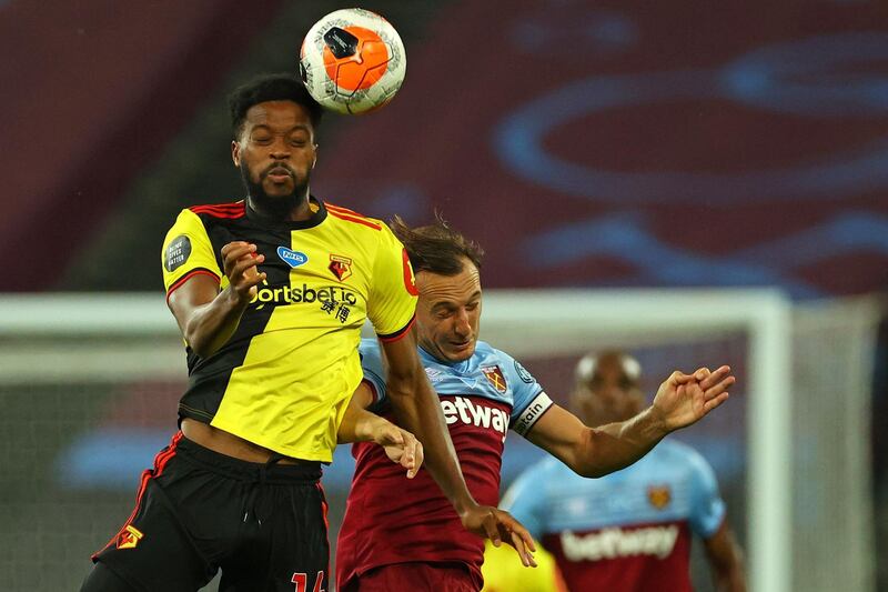 Watford midfielder Nathaniel Chalobah, left, vies with West Ham United's Mark Noble, making his 500th appearance for the club. AFP