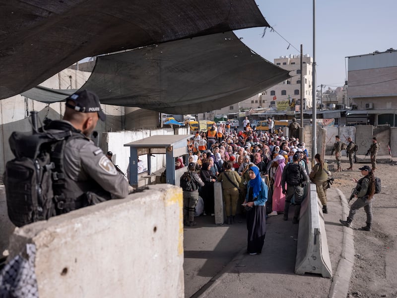 Palestinians at a checkpoint near the Israeli separation barrier, in the occupied West Bank. AP