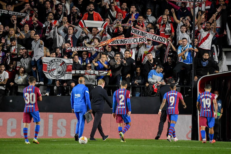 Rayo Vallecano supporters cheer as Barcelona's Dutch coach Ronald Koeman and players leave the pitch. AFP