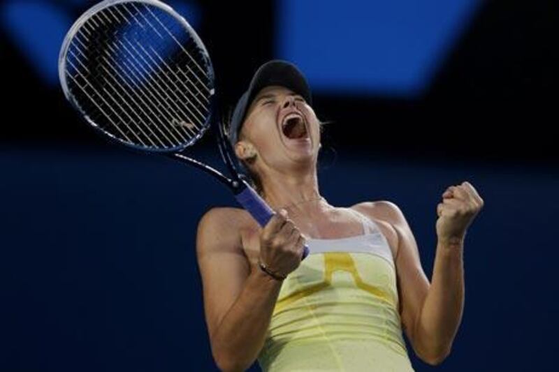 Maria Sharapova celebrates after defeating Venus Williams in their third round match at the Australian Open.