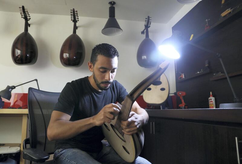 Abu Dhabi, United Arab Emirates - August 7, 2018: Assistant Oud builder Ahmed Anwer has been creating Ouds for over 3 years. Pictured at the Bait Al Oud workshop where they make different arabic instruments. Tuesday, August 7th, 2018 at Al Nahyan, Abu Dhabi. Chris Whiteoak / The National