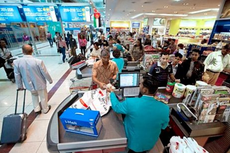Dubai, December 5, 2010 - Airline passengers purchase goods at one of several duty free shops in Dubai's Airport Terminal 3, December 5, 2010. (Jeff Topping/The National)