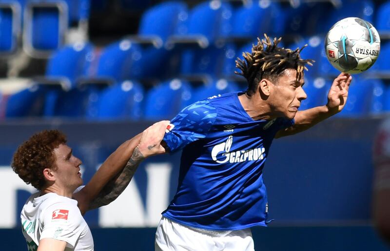 Schalke's Jean-Clair Todibo heads the bal. AFP