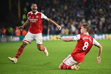Arsenal's Norwegian midfielder Martin Odegaard celebrates scoring his team's second goal during the English Premier League football match between Wolverhampton Wanderers and Arsenal at the Molineux stadium in Wolverhampton, central England on November 12, 2022.  (Photo by Oli SCARFF / AFP) / RESTRICTED TO EDITORIAL USE.  No use with unauthorized audio, video, data, fixture lists, club/league logos or 'live' services.  Online in-match use limited to 120 images.  An additional 40 images may be used in extra time.  No video emulation.  Social media in-match use limited to 120 images.  An additional 40 images may be used in extra time.  No use in betting publications, games or single club/league/player publications.   /  
