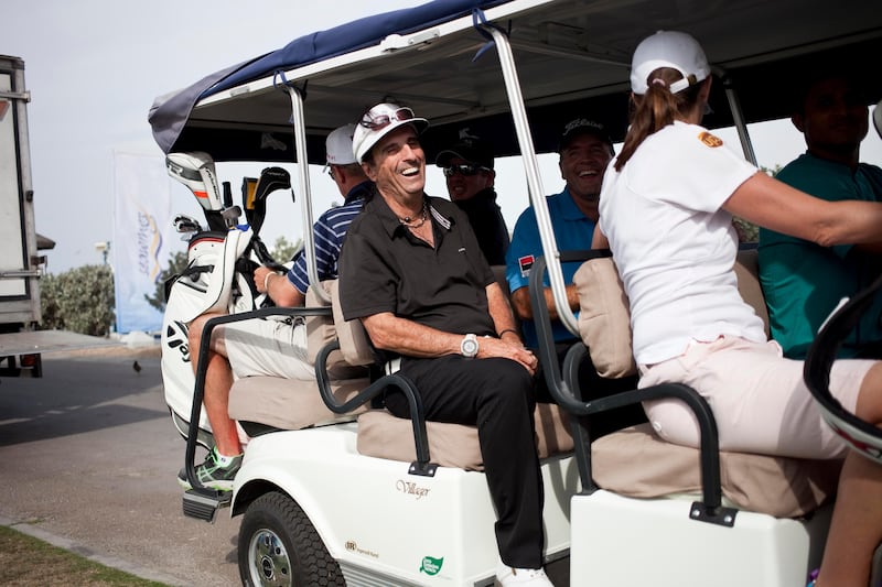 Dubai, United Arab Emirates - January 29 2012 - Former rock legend Alice Cooper rides a golf cart at the Jebel Ali Hotel and Golf Resort prior to competing at the "Challenge Match", a part of the Dubai Desert Classic. (Razan Alzayani / The National) 