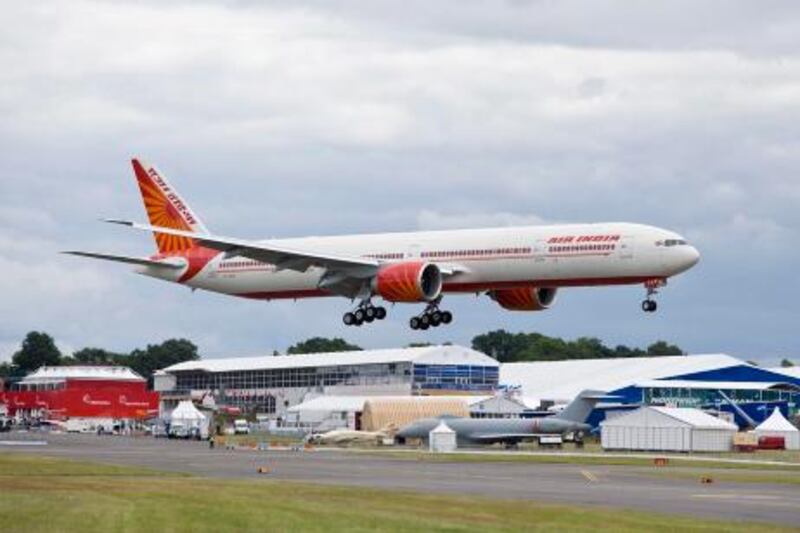epa02253776 A Boeing handout image showing an Air India 777-300ER landing at Farnborough, Britain, 12 July 2010, to be the 777 showcase at the Air Show. Boeing and Dubai-based Emirates Airlines announced on 19 July 2010 an order for 30 Boeing 777-300ERs (Extended Range) at the 2010 Farnborough International Airshow. According to Boeing communique  Emirates is already the world's largest 777 operator with a fleet of 86 777s through direct purchase and lease, plus an additional 16 777-300ERs previously on order. It is also the only airline in the world to operate every model in the Boeing 777 family, including the 777 Freighter.  EPA/ED TURNER/HANDOUT  EDITORIAL USE ONLY/NO SALES *** Local Caption ***  02253776.jpg