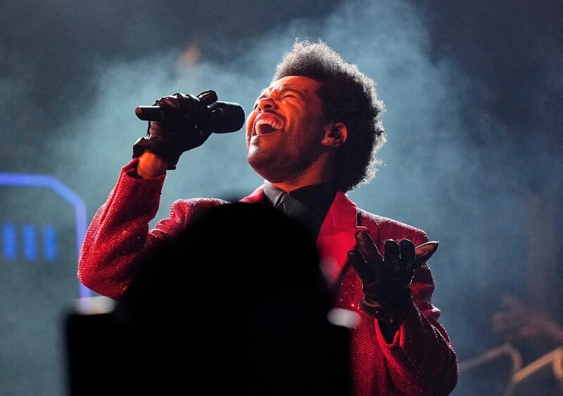 FILE - The Weeknd performs during the halftime show of the NFL Super Bowl 55 football game on Feb. 7, 2021, in Tampa, Fla.  The Weeknd was snubbed by the Grammys but heâ€™s the leading nominee at the 2021 Billboard Music Awards.  (AP Photo/David J. Phillip, File)