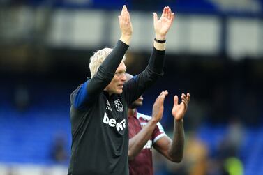 West Ham United's Scottish manager David Moyes and West Ham United's English midfielder Michail Antonio applaud supporters as they leave after the English Premier League football match between Everton and West Ham United at Goodison Park in Liverpool, north west England on October 17, 2021.  - West Ham won the game 1-0.  (Photo by Lindsey Parnaby / AFP) / RESTRICTED TO EDITORIAL USE.  No use with unauthorized audio, video, data, fixture lists, club/league logos or 'live' services.  Online in-match use limited to 120 images.  An additional 40 images may be used in extra time.  No video emulation.  Social media in-match use limited to 120 images.  An additional 40 images may be used in extra time.  No use in betting publications, games or single club/league/player publications.   /  