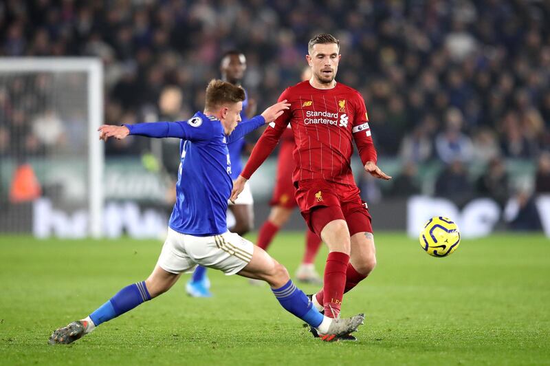 Jordan Henderson of Liverpool is tackled by Harvey Barnes of Leicester City on Thursday. Getty Images