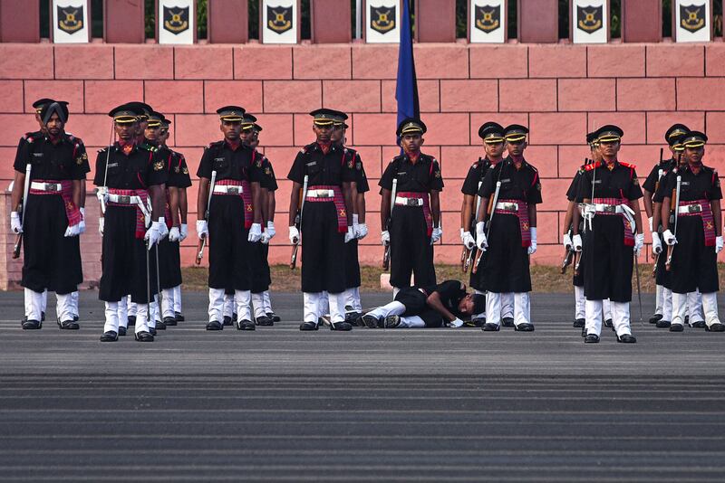 An Indian army cadet collapses during a passing out parade at Officers Training Academy in Chennai. EPA 