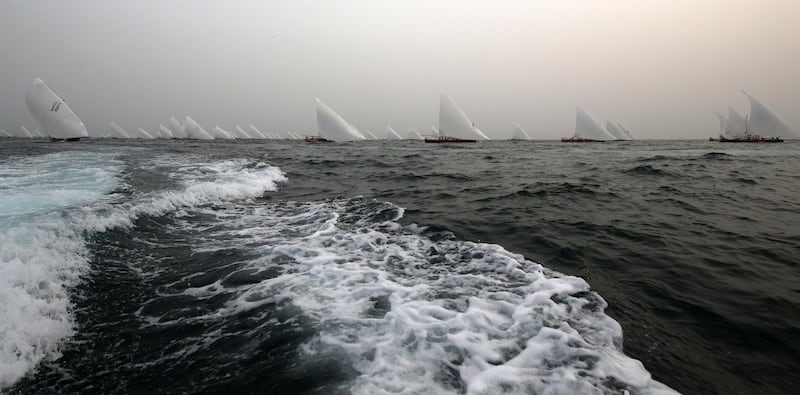 Teams sail traditional wooden dhows, during the Al Gaffal long-distance sailing race near the island of Sir Bu Nayer, Abu Dhabi. Karim Sahib / AFP Photo