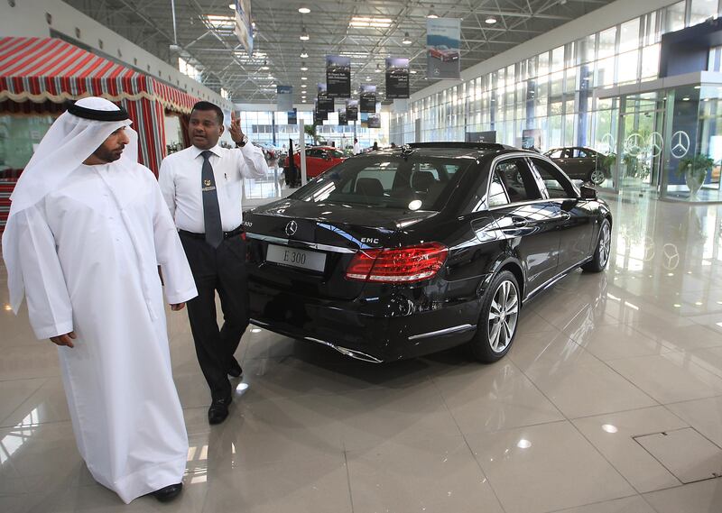 ABU DHABI - UNITED ARAB EMIRATES - 13MAY2013 - Customers looks at the cars Emirates Motor Company on Airport road in Abu Dhabi. Ravindranath K / The National