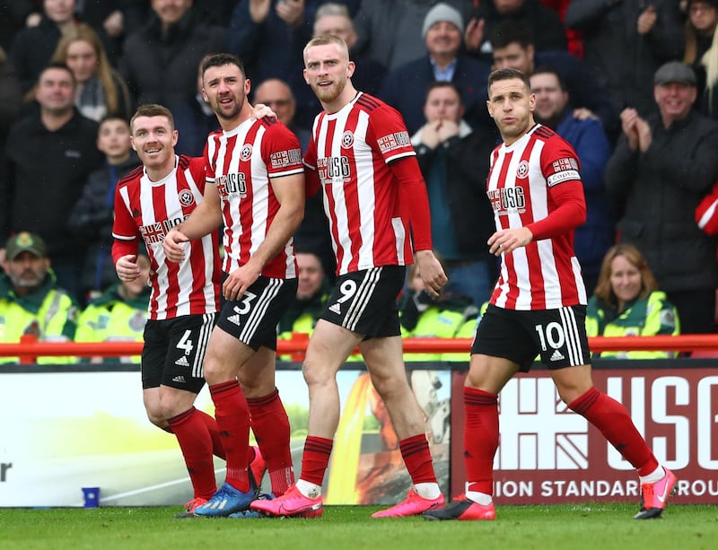 SHEFFIELD, ENGLAND - FEBRUARY 22: Enda Stevens of Sheffield United celebrates with teammates after scoring his team's first goal during the Premier League match between Sheffield United and Brighton & Hove Albion at Bramall Lane on February 22, 2020 in Sheffield, United Kingdom. (Photo by Matthew Lewis/Getty Images)