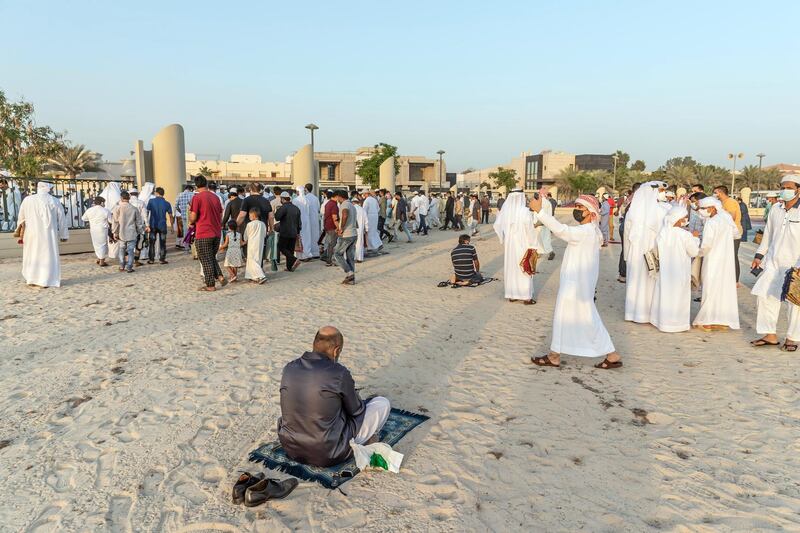 Eid prayers, also known as Salat al-Eid and Șālat al-'Īdayn, is the special prayers (salah) offered to celebrate the Islamic festival at the end of the Holy Month of Ramadan. Traditionally it is held in an open space, Eidgah, such as an allocated spcae or field specifically available for prayer. The UAE Authorities allowed communal Eid prayers again this year with a strict policy of social distancing anf a 15 minite prayer access throughout the UAE after last years locdown due to the Covid - 19 pandemic. Worshippers attend the Eid Prayer at the Umm Suquim Eid prayer grounds on May 13 th, 2021. 
Antonie Robertson / The National.
Reporter: None for National.