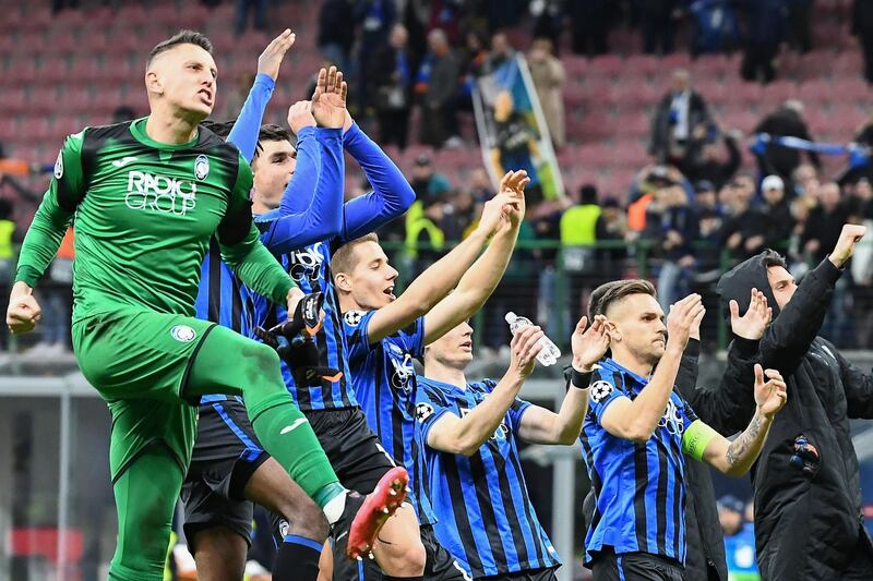 Atalanta's Italian goalkeeper Pierluigi Gollini and teammates celebrate their Champions League win against Valencia. AFP