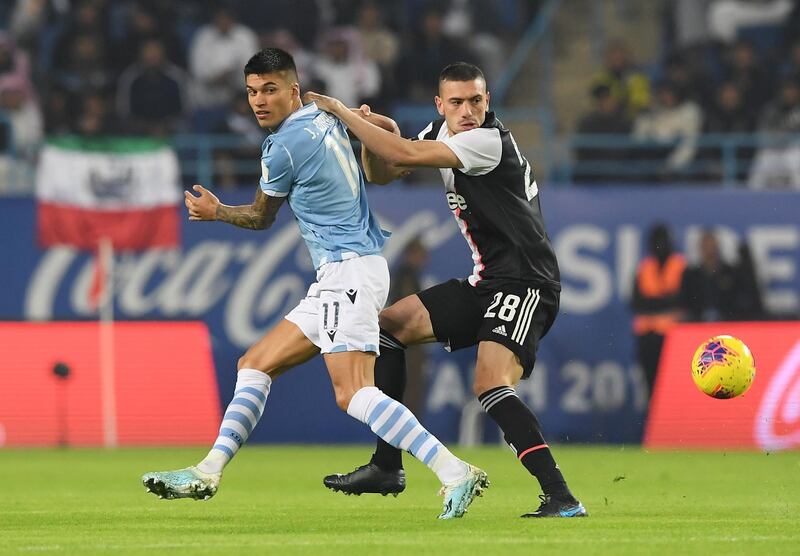 Lazio's Joaquin Correa in action with Juventus' Merih Demiral. Reuters