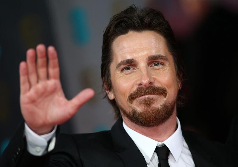 Christian Bale arrives on the red carpet. Andrew Cowie / AFP photo