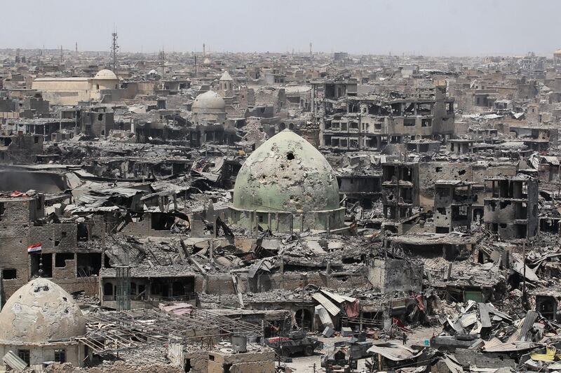 (FILES) In this file photo taken on July 09, 2017 A picture taken on July 9, 2017, shows a general view of the destruction in Mosul's Old City. Iraqi forces announced the "liberation" of the country's second city on July 10, 2017, after a bloody nine-month offensive to end the Islamic State (IS) group's three-year rule there. 
Scores of people are still displaced in and around Mosul as the city lies in ruins, one year after it was retaken from IS. 

 / AFP / AHMAD AL-RUBAYE
