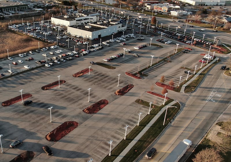 A new car dealership display lot in Gurnee, Illinois, US, sitting nearly empty as new vehicle production levels worldwide remain low. EPA