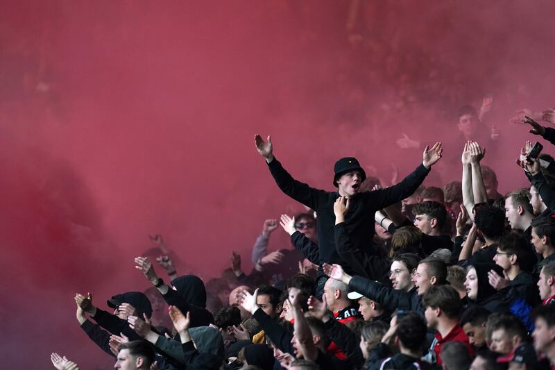 AZ fans let of flares during the match against West Ham. PA