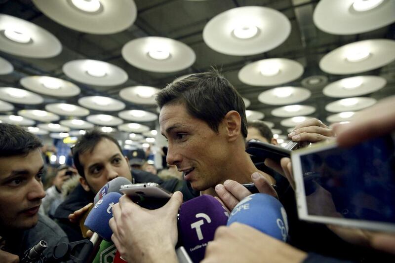 Fernando Torres answers questions upon his arrival in Madrid on Tuesday to join Atletico Madrid. Javier Lizon / EPA