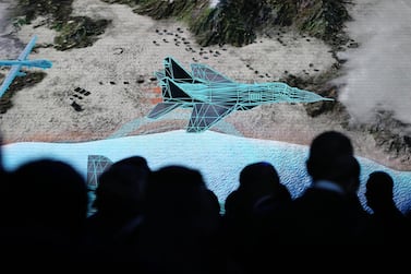 Guests watch a presentation by EDGE as the conglomerate is unveiled in Abu Dhabi on Tuesday. Pawan Singh / The National