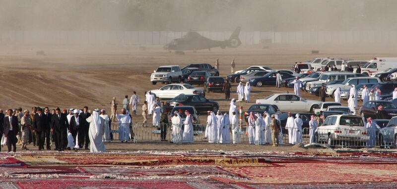 Abu Dhabi, UAE. November 3 2004. Mourners gather and wait for the funeral convoy of Sheikh Zayed at his grave site at the Sheikh Zayed mosque.(C) Al Ittihad